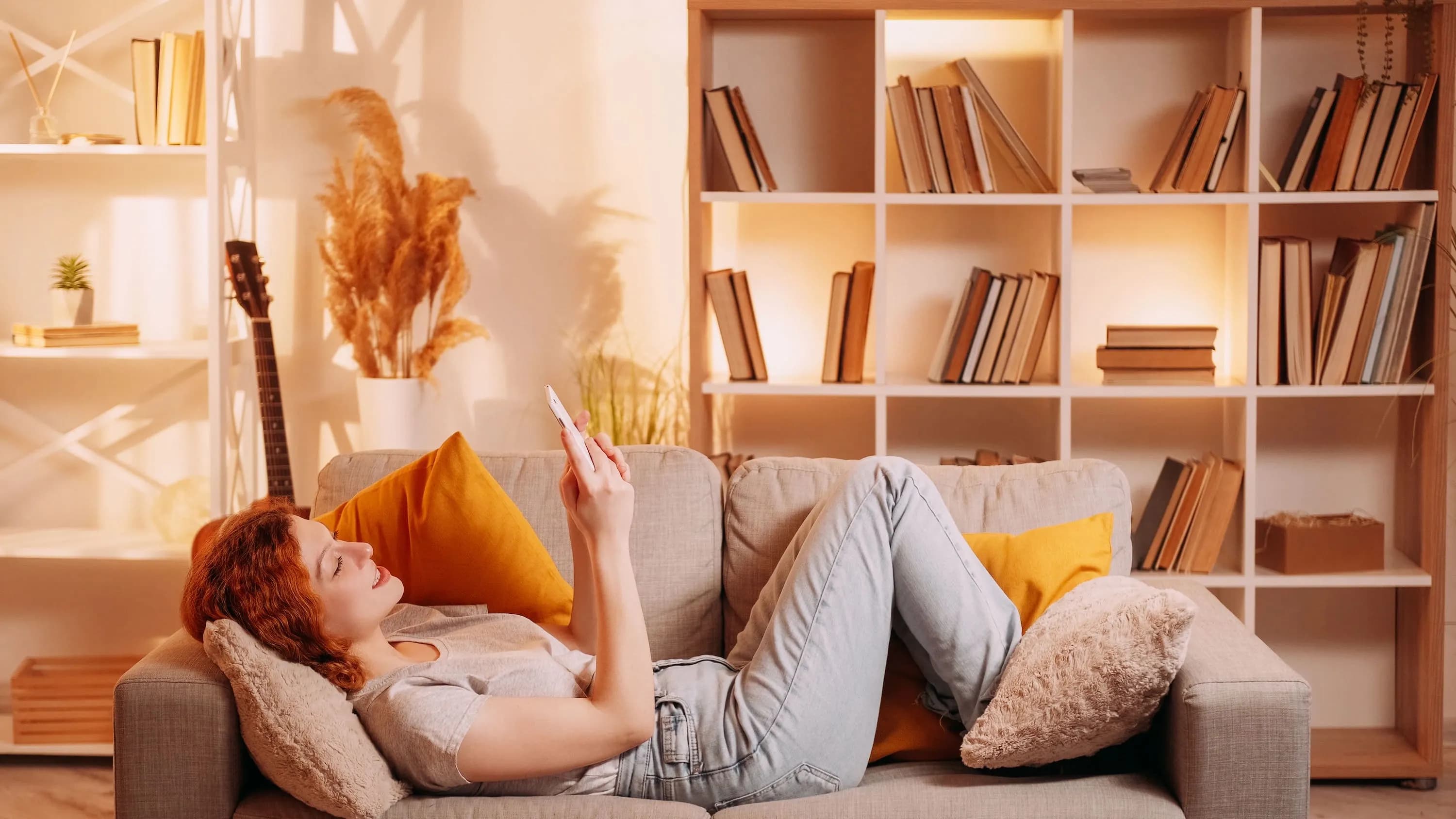 Woman laying on the sofa feeling warm